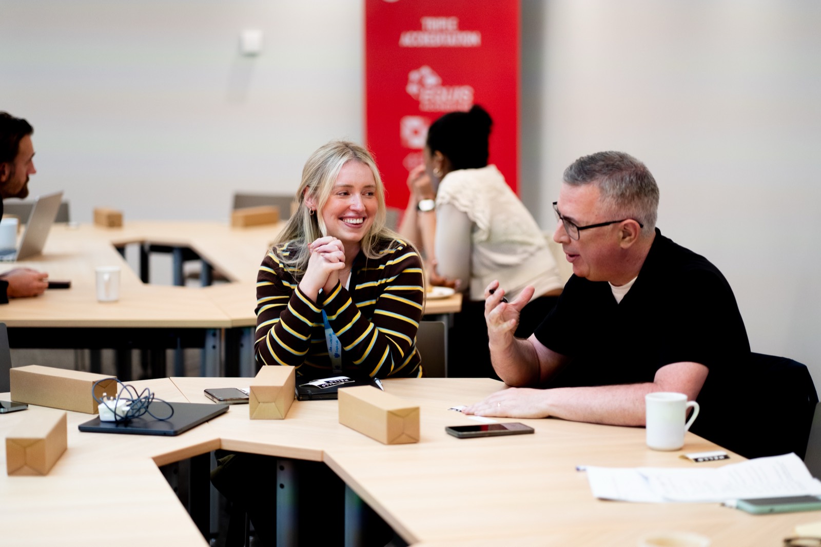 Builders in discussion at the AI Build Day in Derry